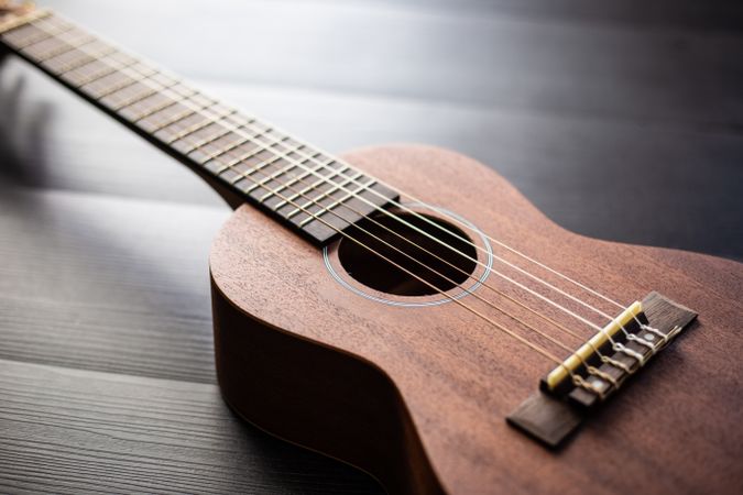 Ukulele on wooden tabletop