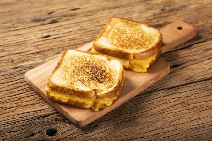 Grilled ham and cheese. Sandwich with cheese and ham on grill.