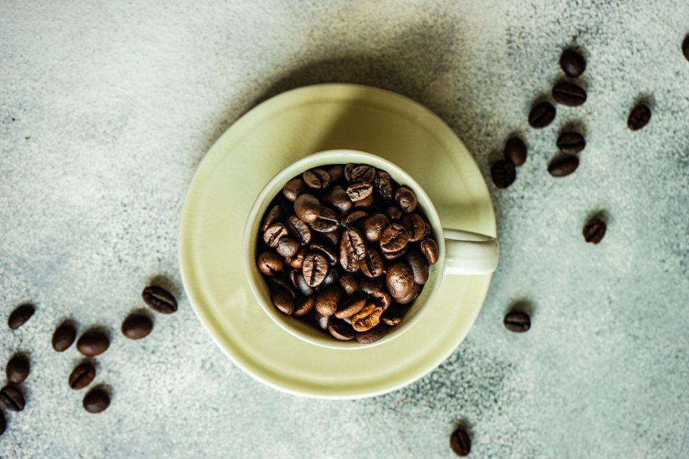 Top view of coffee beans in cup