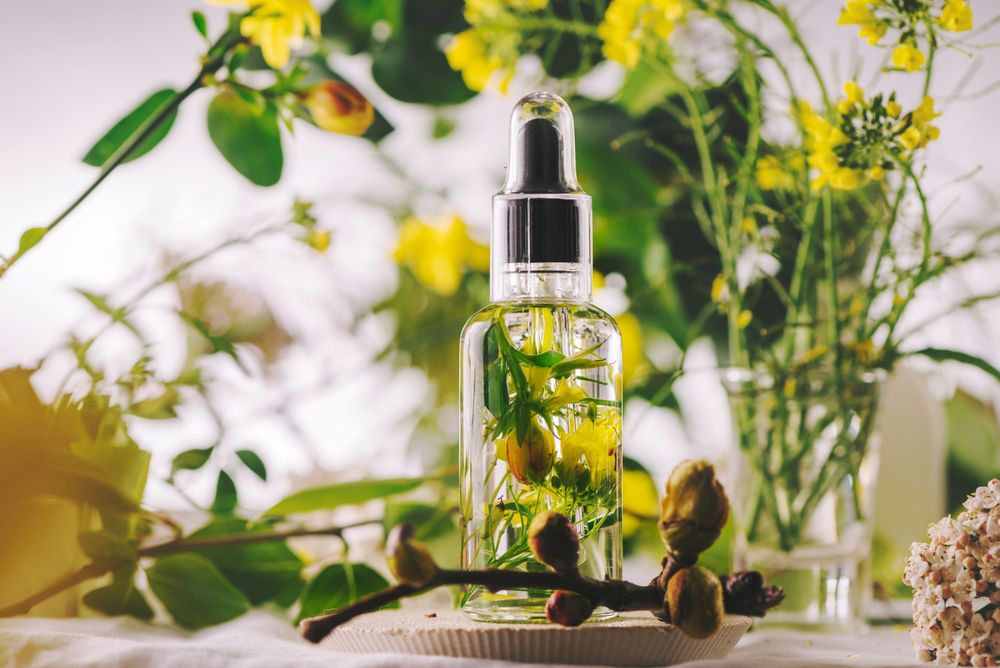 Essential oil, with flowers and natural herbs