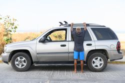 Anonymous woman standing near car