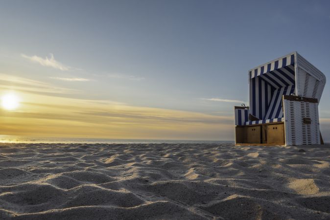 Sand beach and wicker chair