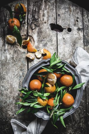 Mandarins and basket on table