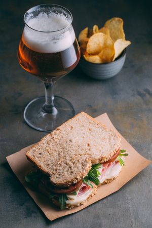 Delicious sandwich with ham, cheese, lettuce and tomato