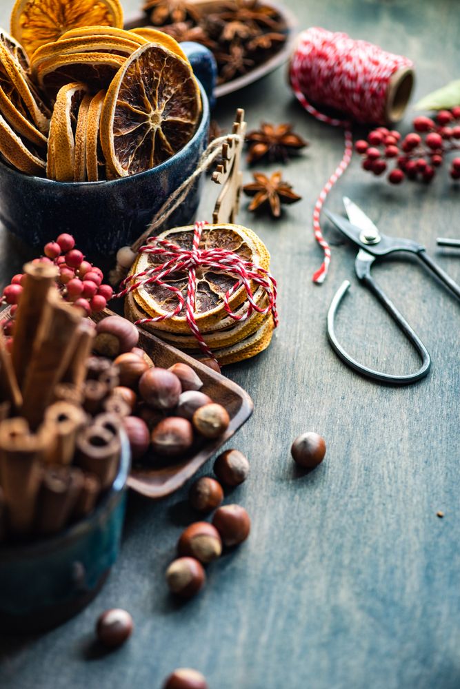 Christmas food concept or dried slices, nuts and cinnamon