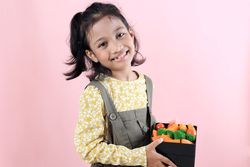 Smiling Asian Girl with Her Healthy School Lunchbox