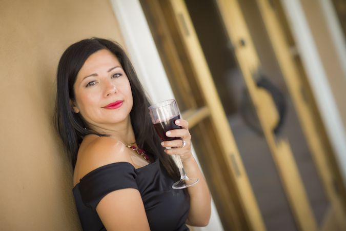 Hispanic Woman Portrait Outside Enjoying Wine
