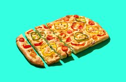 Vegan focaccia isolated on a green background