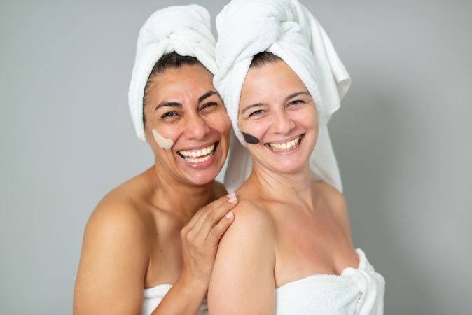 Happy women with strokes of masks