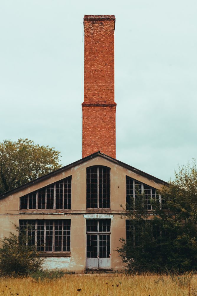 Facade of old building and cloudy sky