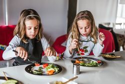 Kids eating vegan food at home