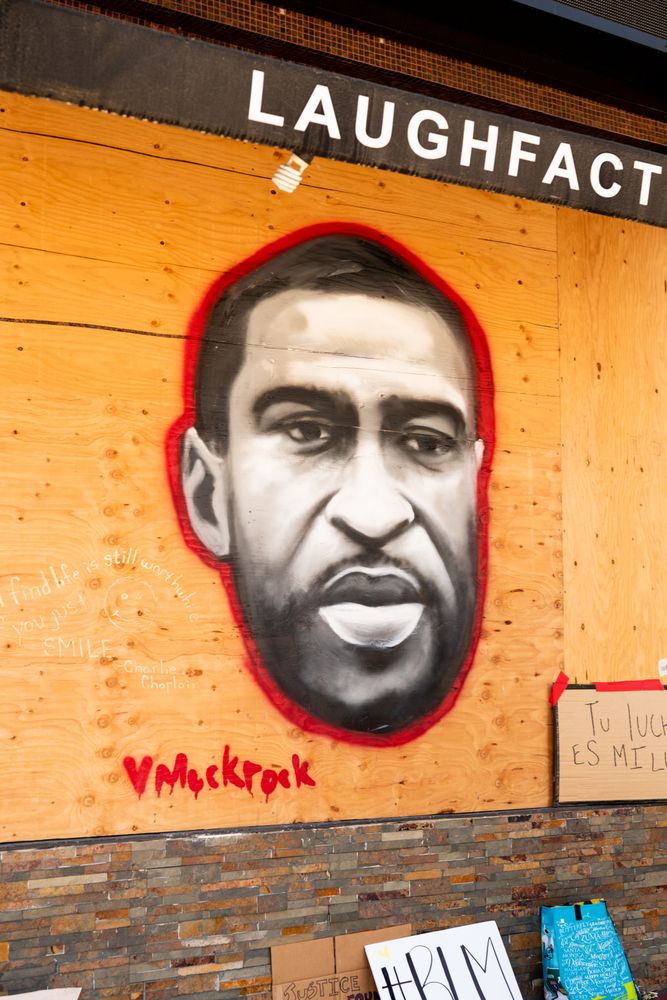 Los Angeles, CA, USA — June 14th, 2020: wheat paste of George Floyd on wall of boarded up business