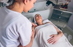 Woman receiving a relaxing massage on arm and shoulders