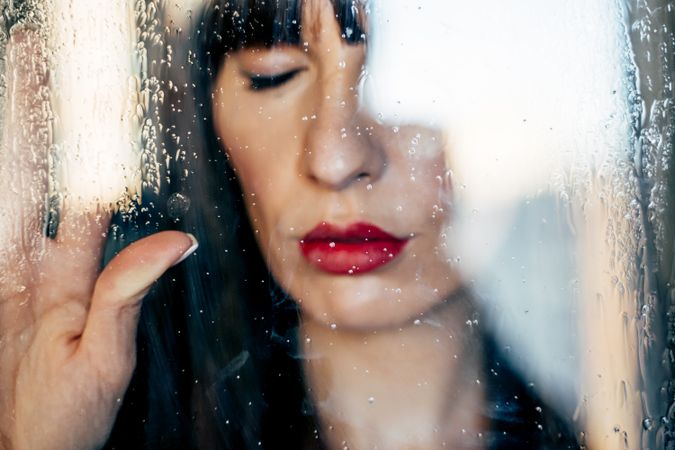 Stylish woman kissing glass