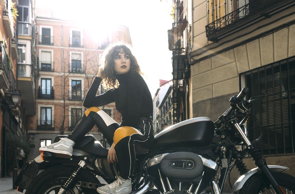 Young woman in custom motorbike