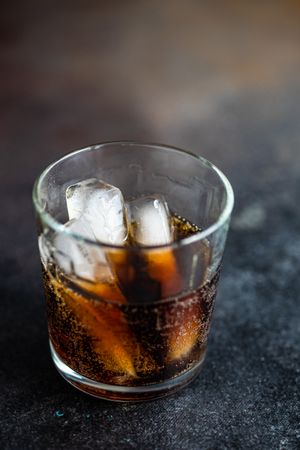 Side view of glass of cola