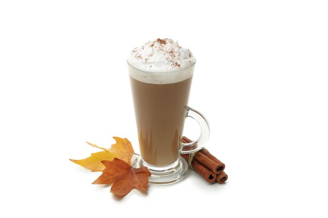 Glass of latte isolated on neutral background