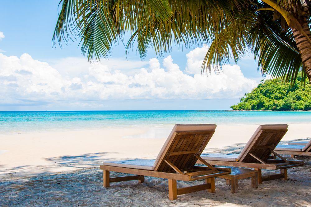 Brown wooden chair on beach