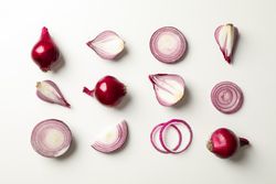 Flat lay composition with red onion on neutral background
