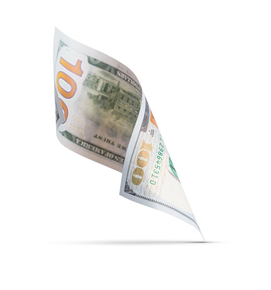 One Hundred Dollar Bill Floating Down To Surface with Drop Shadow