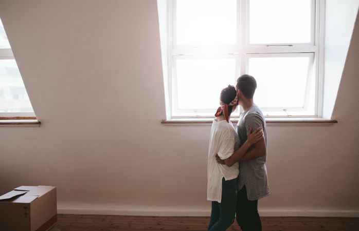 Newly engaged couple moving into new house together