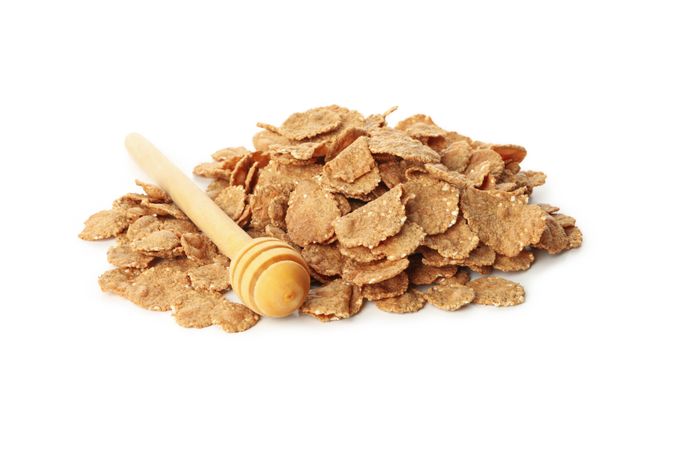 Chocolate muesli and dipper isolated on plain background