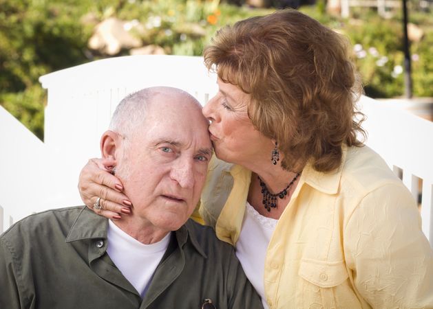 Mature Couple Kissing in the Park