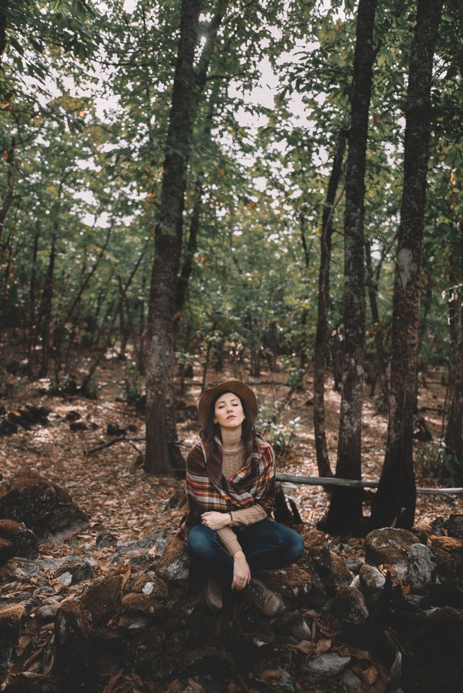 Young woman relaxing in forest