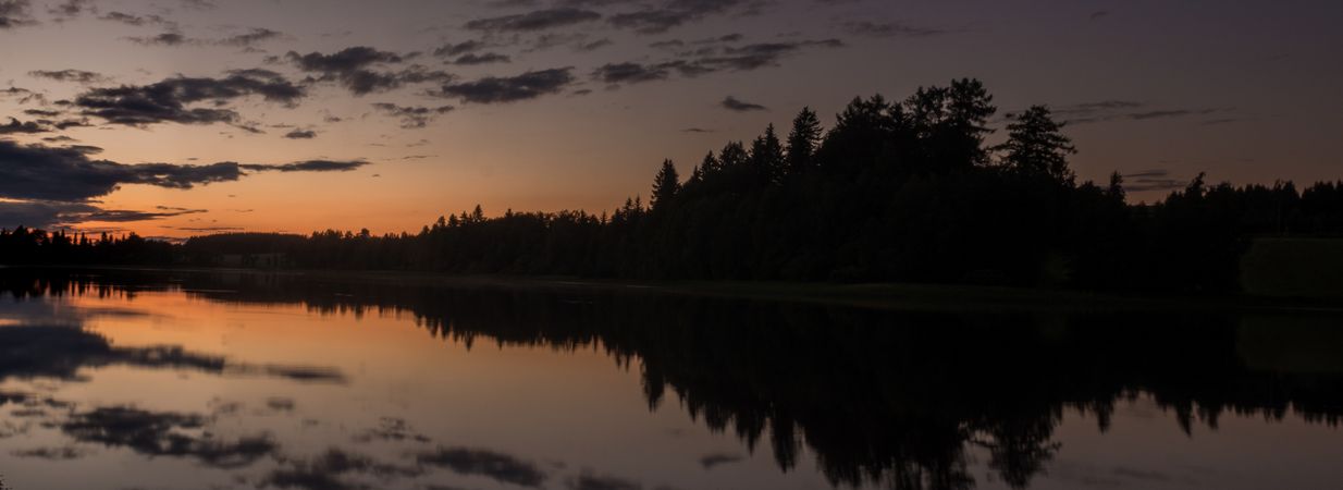 Sunset landscape with river and forest