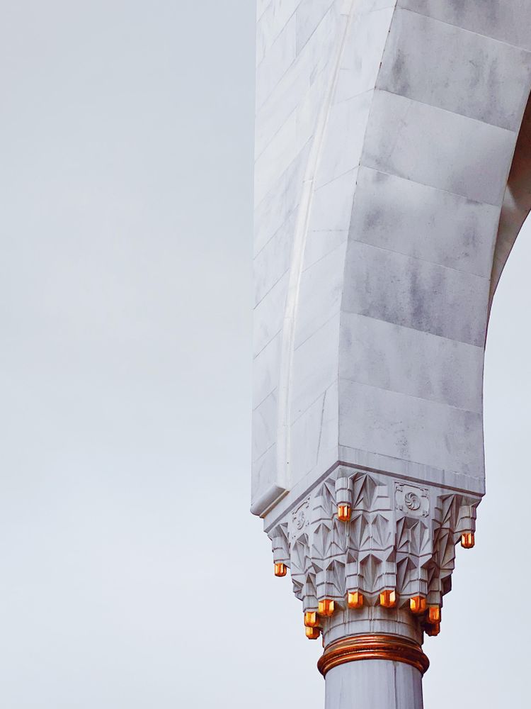 Gold details of marble pillar