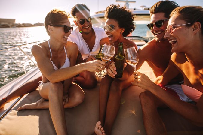Fun group of people enjoying party on yacht