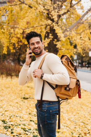 Stylish male talking on mobile phone