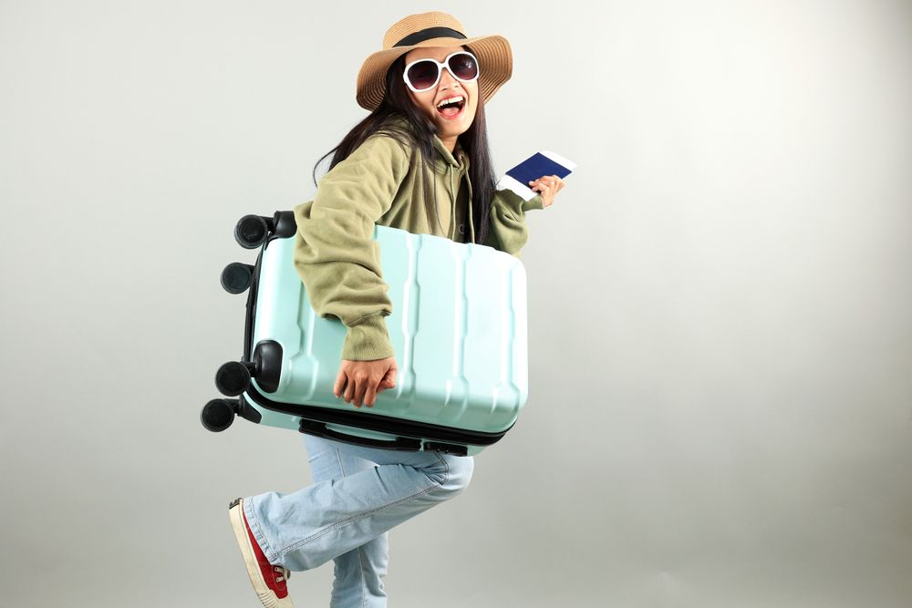 Young Traveler Asian Woman with Luggage, Ticket, and Passport