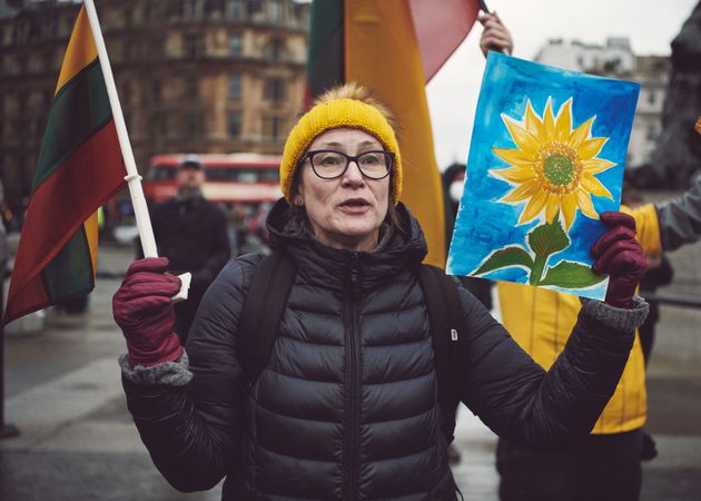 London, England, United Kingdom - March 5 2022: Woman with sunflower painting at protest