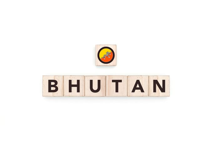 Wooden blocks bearing the name and flag of Bhutan.