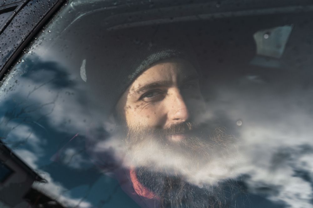 Smiling man sitting in car