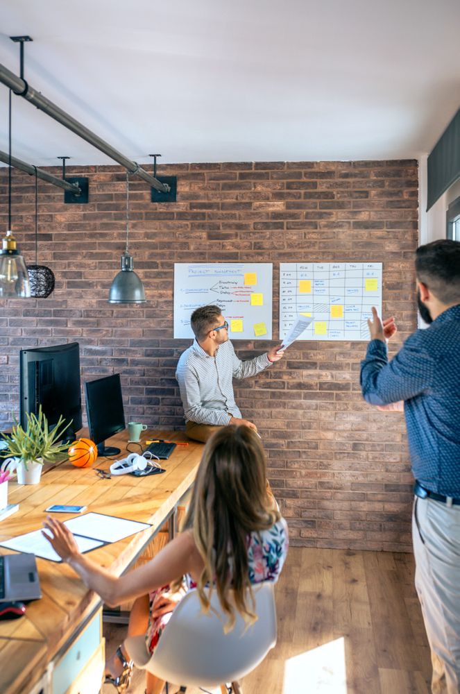 Manager organizing work in an office