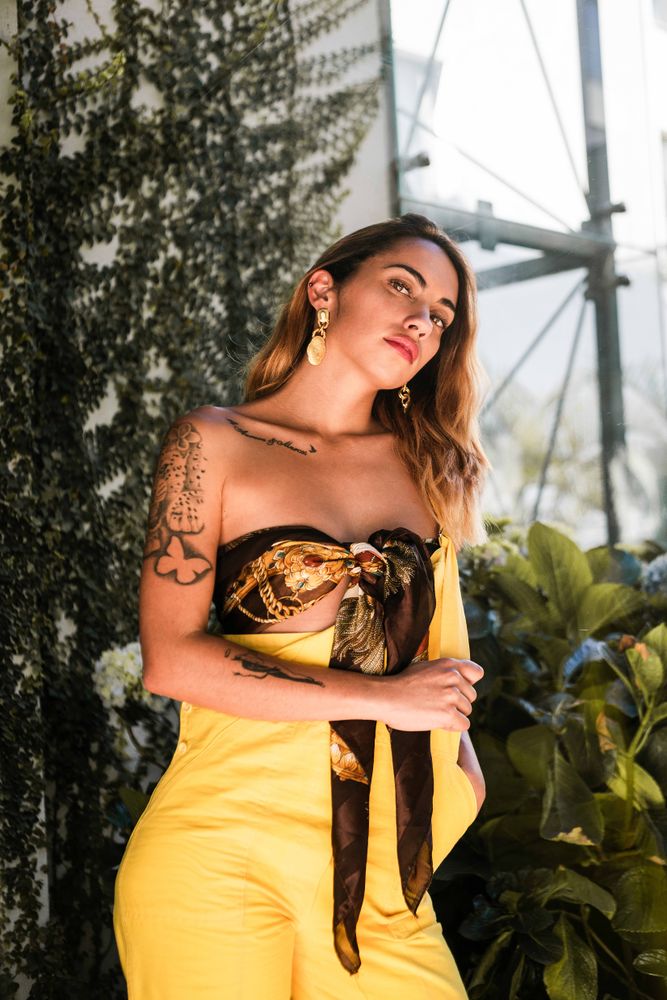 Young stylish woman in garden