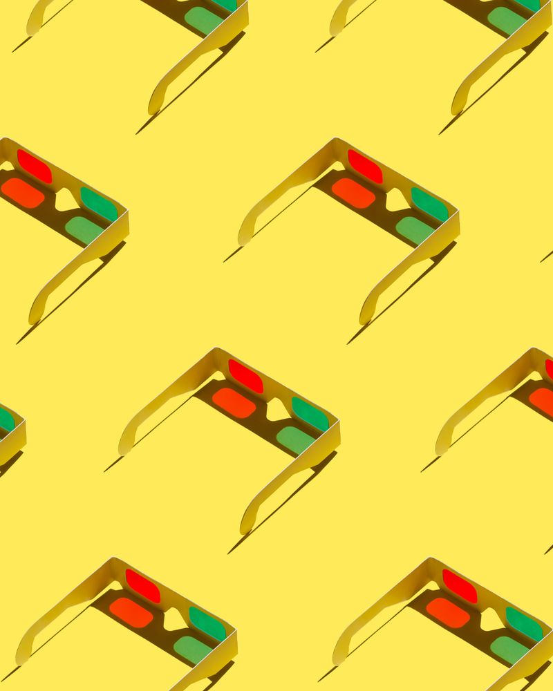 3D glasses on yellow background