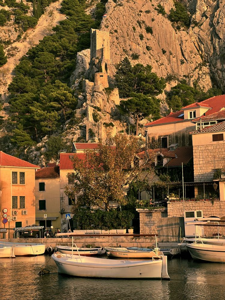 Boats in Centina river in foreground of castle