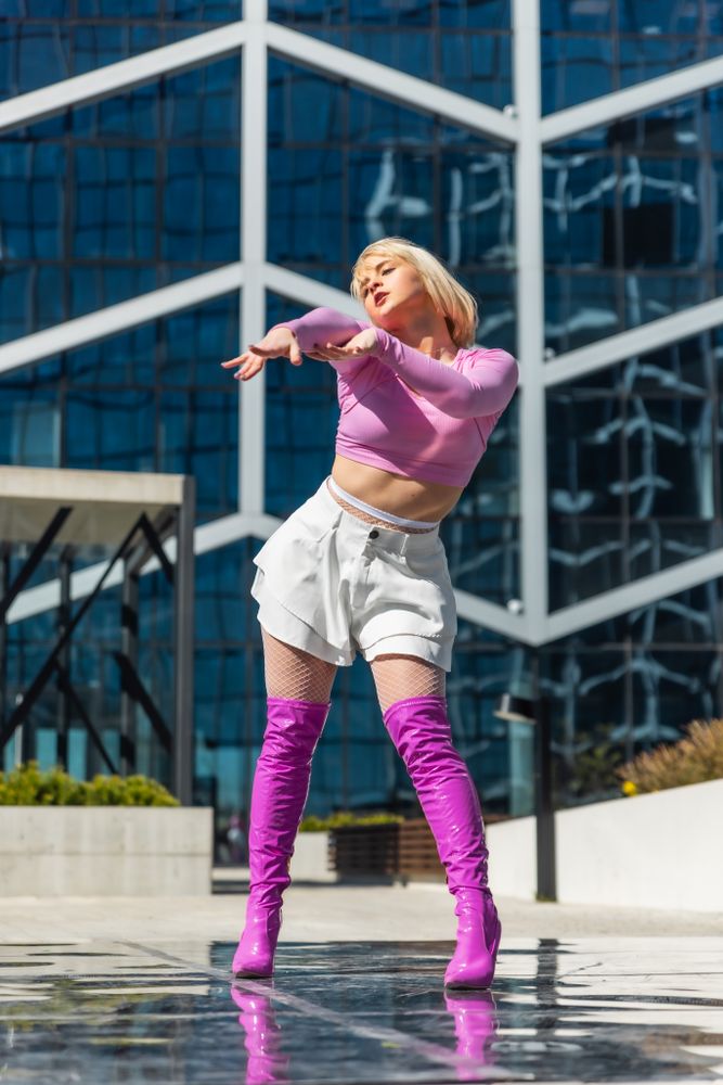 Vertical Screen: Beautiful And Fashionable Young Woman Voguing On Street.