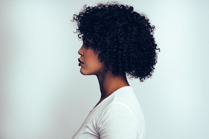 Side view studio portrait of elegant woman