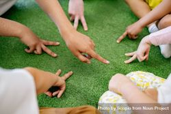 Cropped image of group of kindergarten children sitting in circle 4AXMz5