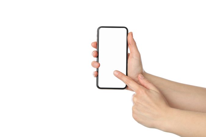 Female hands holding phone with empty screen, isolated on plain background