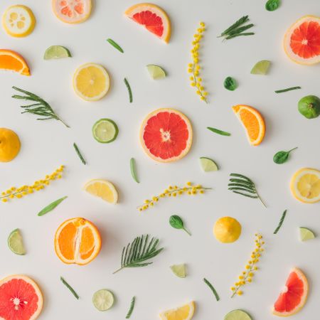 Colorful vegetable pattern made of lemon, grapefruit, lime and yellow flowers