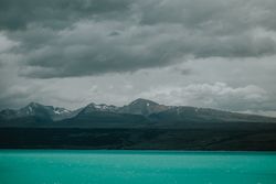 Sea coast with turquoise water and rocky mountains