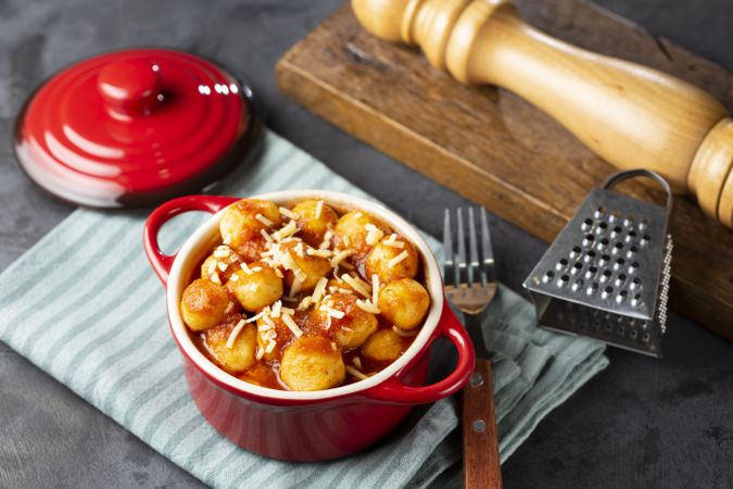 Gnocchi with tomato sauce and grated Parmesan cheese.