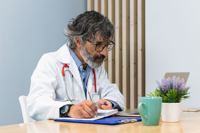 Doctor doing paperwork in hospital