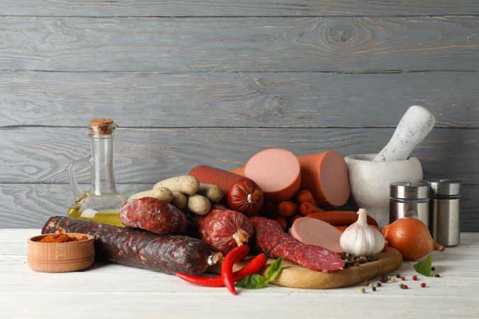 Board of cured meats with garlic, spices and herbs