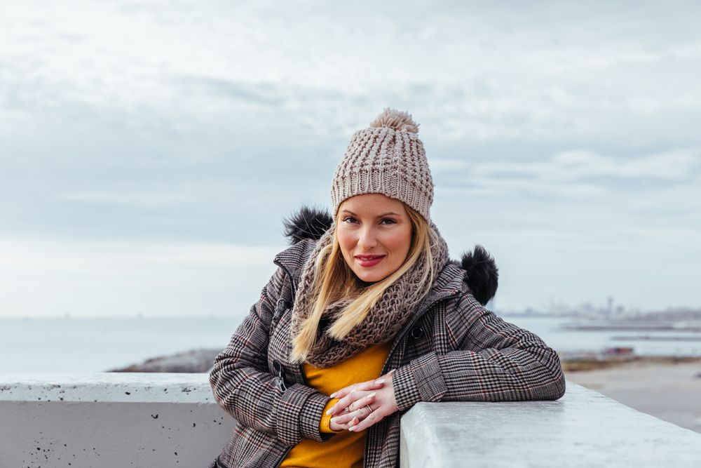 Portrait of blonde woman posing in the city